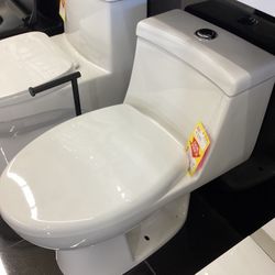 One Piece Elongated Toilet Including Seat
