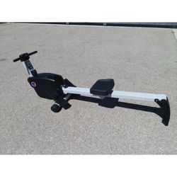 Rowing Machine with adjustable tension for resistance and folded up feature for space saver “new”