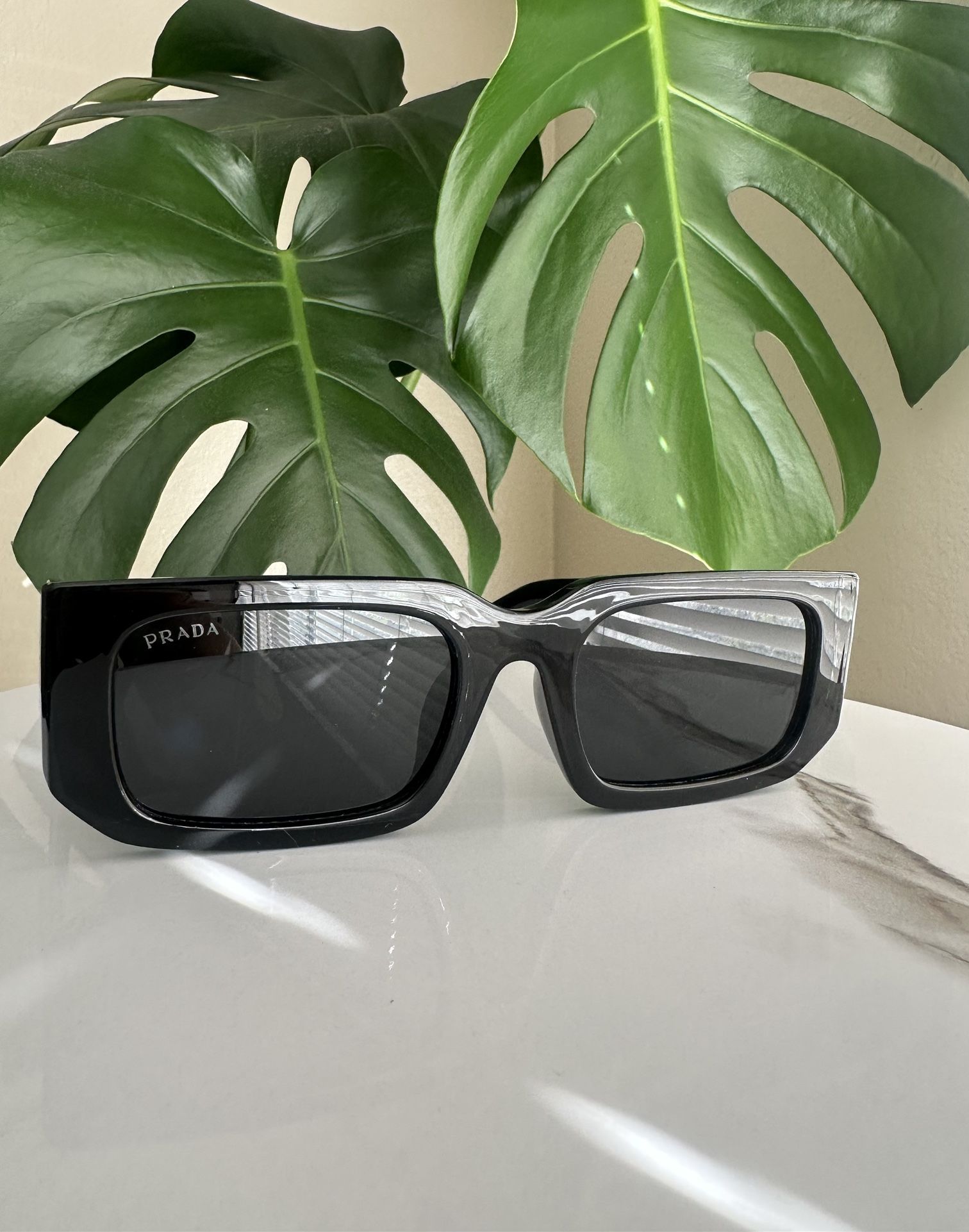 Luxury Black Sunglasses Logo