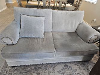 Gray couch and loveseat. Bought from  Living Spaces. Pet and smoke free home. $1000.00 obo