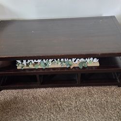 Solid wood  coffee table with three drawers that open on both sides