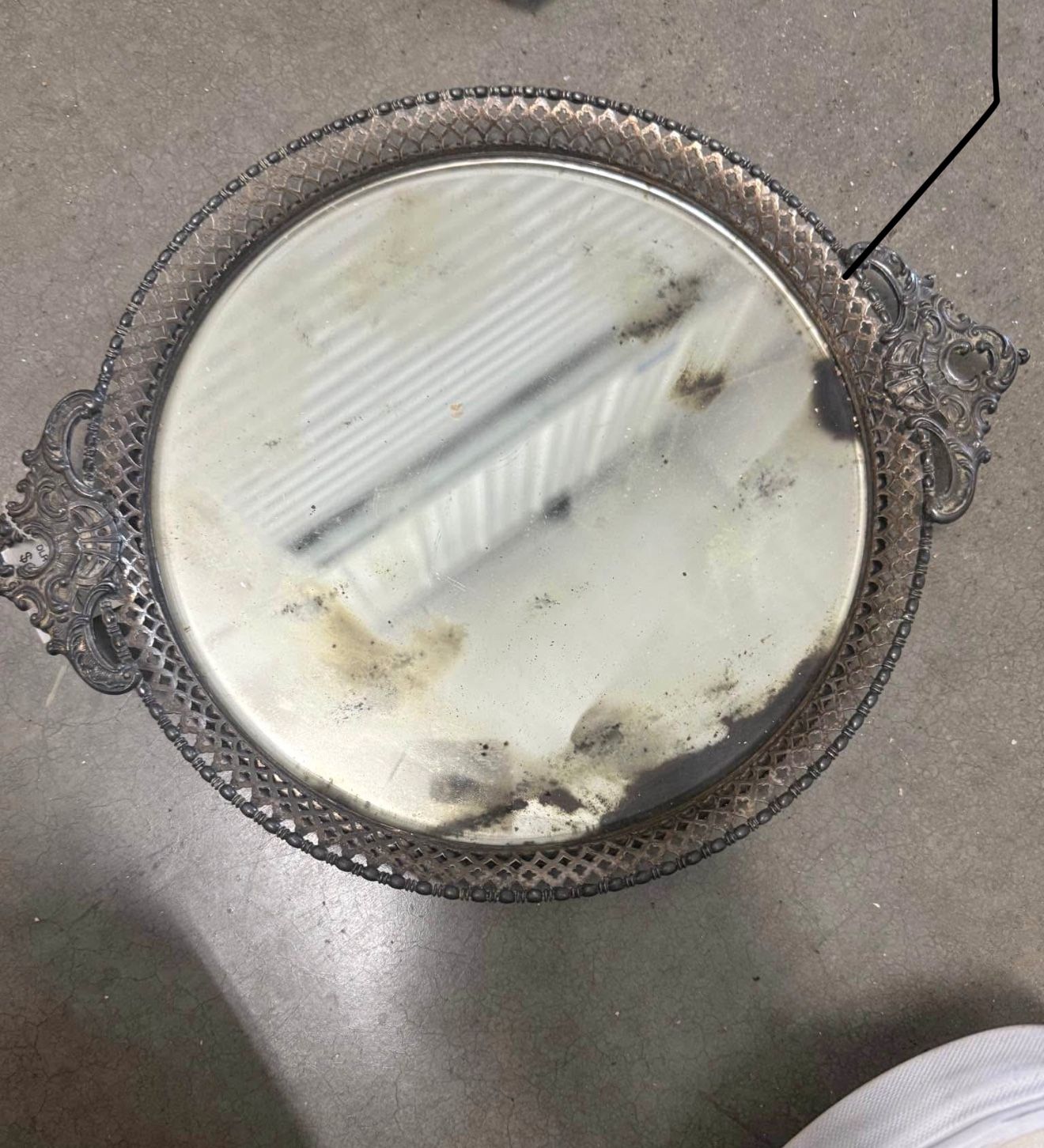 vintage mirrored tray with a silver-plated rim.