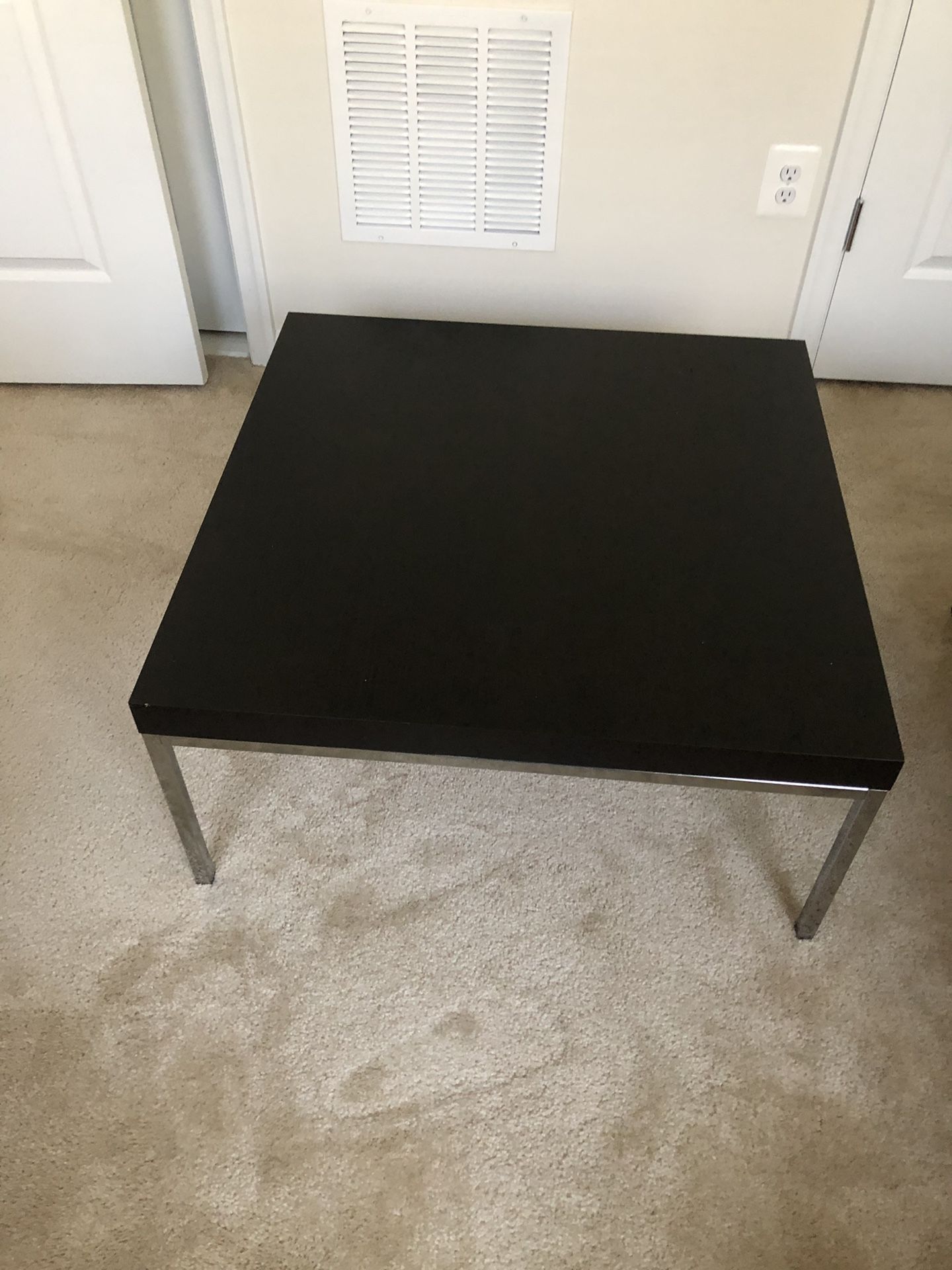 Black coffee table with metal base