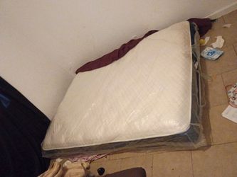 King size mattress used plastic still on mostly except one side