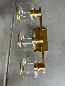 Simply Living 18 in. 3-Light Modern Brass Vanity Light with Clear Cylinder Shade