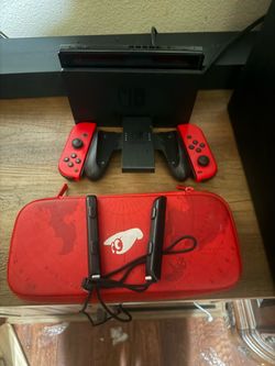 Nintendo Switch with Red Joy-Cons and Carrying Case