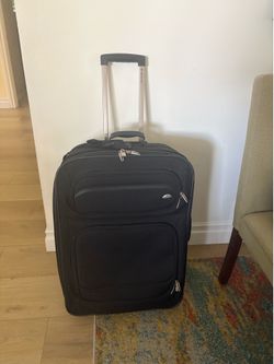 Black Samsonite luggage 27”
