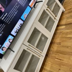 White TV stand with gold hardware