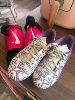 Girls soccer cleats and shin guards