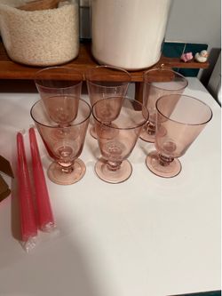Pink glass cups and candle sticks