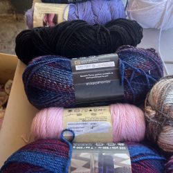 balls of yarn for knitting with two boxes full