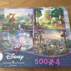 Disney: 4 new 500 piece sealed puzzles by Thomas Kinkade
Mickey Fantasia
Winnie the Pooh & friends
Rapunzel & Flynn in a boat
Lady & the Tramp
Puzzle 