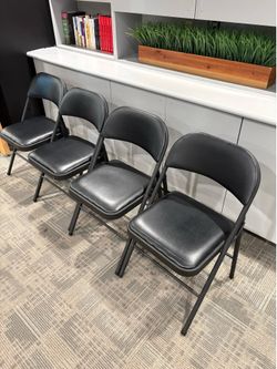 Black metal foldinging chairs with padded vinyl seats (SET OF 4)