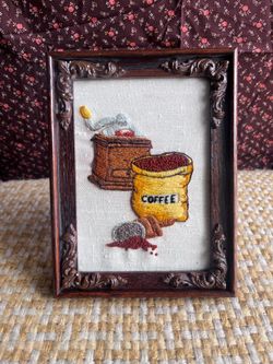 Rustic vintage embroidery of coffee that is framed