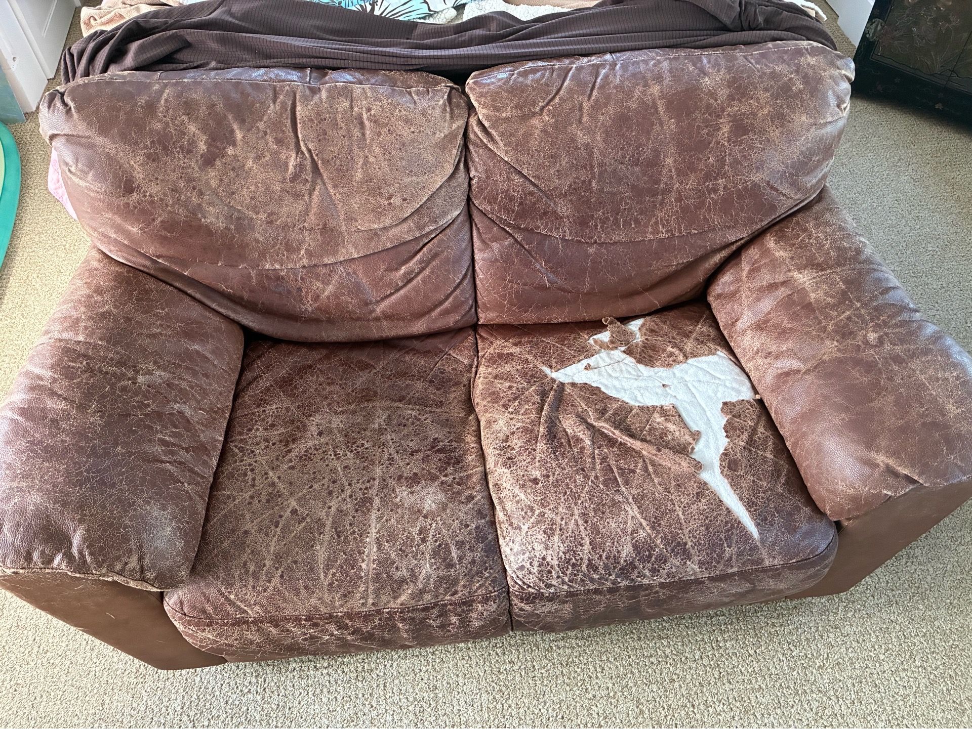 FREE please take ! Leather Loveseat to reupholster
