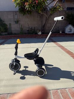 Tricycle for children with push handle