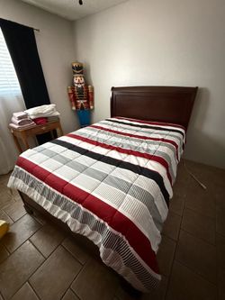 Full sized bed, frame, headboard and footboard.