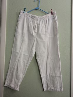 Stylish Lena Gabrielle pants in size 16. These trousers have a metallic bronze snakeskin print throughout. The fabric is a stretch material with a fla