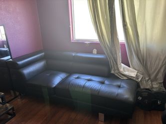 Black leather Couch Fits 3 People Comfortably. Pop up Head rest