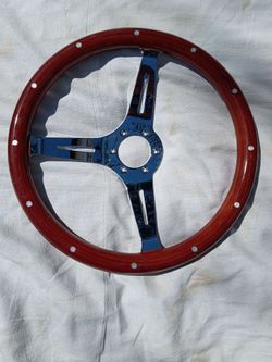 Nice brand new wood grain with chrome spokes steering wheel