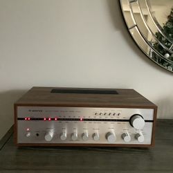 * WINTEC * VINTAGE STEREO RECEIVER IN MINT BRAND NEW CONDITION . MUST BE SEEN TO APPRECIATE . WOOD CASE CABINET . 