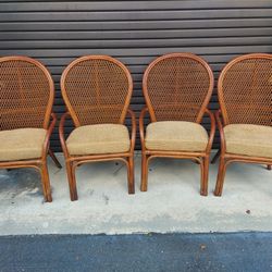 Set of Four Rattan Armchairs with Cushions - In Good Original Gently Used Condition - Measures 24" Wide x 26" Depth and 40 3/4" Tall. Seat 19" Tall. P