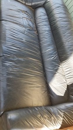 Sofa for free sitting under the shed.