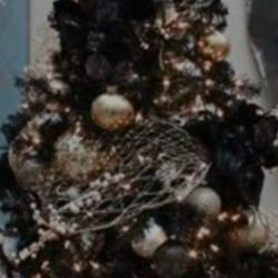 Tall Over 5ft.  It Has Light. Not So.sure How Many Lught Up.  Black In Color  