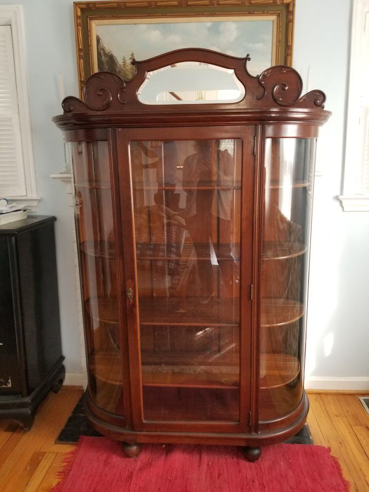 Curved glass front china cabinet
