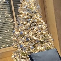 Beautiful Lighted And Flocked Artificial Christmas Tree