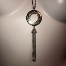Nwot long 19” with a 3” extender silver necklace with a unique circle with tassels hanging at the bottom