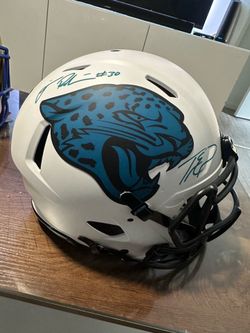 Jax jaguars full sized authentic NFL helmet signed by Trevor and James Robinson