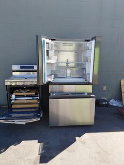 Un Combo De Una Estufa De 5 Quemadores De G AS DOBLE HORNO Tres Meses De Garantia
