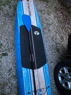 Paddle board with paddle