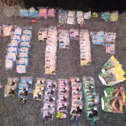 TONS OF UNOPENED 1990'S MCDONALD'S HAPPY MEAL TOYS AND OTHER COLLECTIBLES
