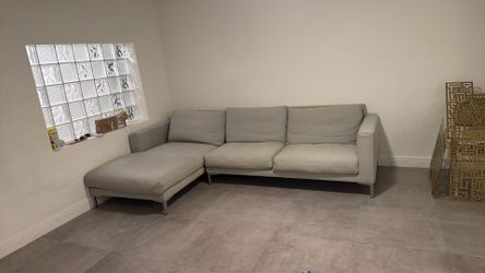 L shape light grey sofa