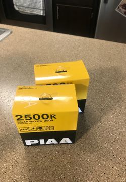 PIAA H4 SOLAR YELLOW HALOGEN HEADLIGHTS NEW