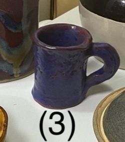 (1) Unique  mug with a rugged, handmade aesthetic look featuring a reactive glaze. studio pottery mug. Blocky, rugged shape with a textured cobalt blu