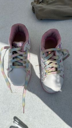 Size 2, hello Kitty Heelys ￼