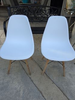 Two white natural dining room side chairs