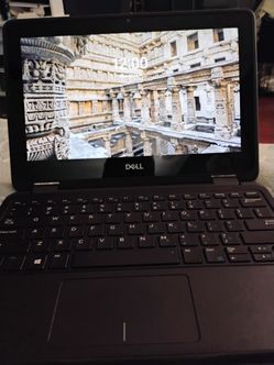 A small Dell touch screen laptop