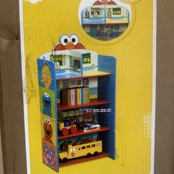 Elmo, bookshelf, and playhouse