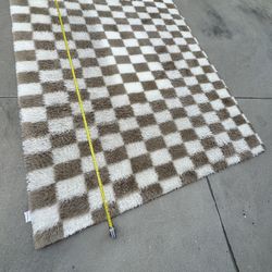 brown and white checkered plush rug 8X10