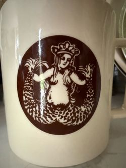 Collectible Starbucks First Store Split Tail Mermaid Ceramic Coffee Mug   Original siren logo on one side. Other side has 'The First Store Starbucks 1
