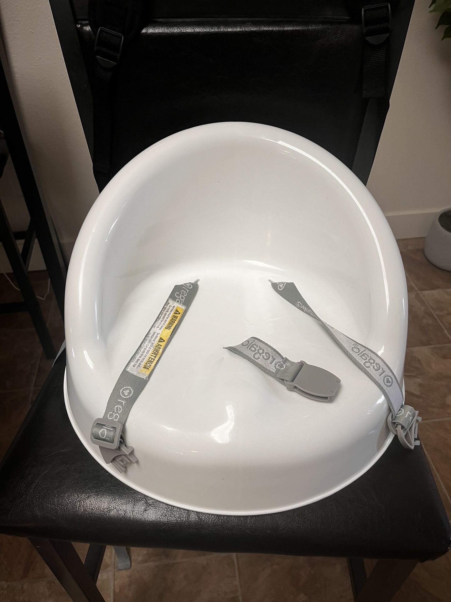 Nice and Clean White Booster Seat With All The Straps
