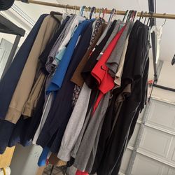 Mixed clothing—small and large sizes—for men, women, and children.