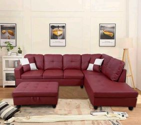 Red leather sectional couch and ottoman