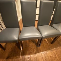 4 Faux leather dining chairs 