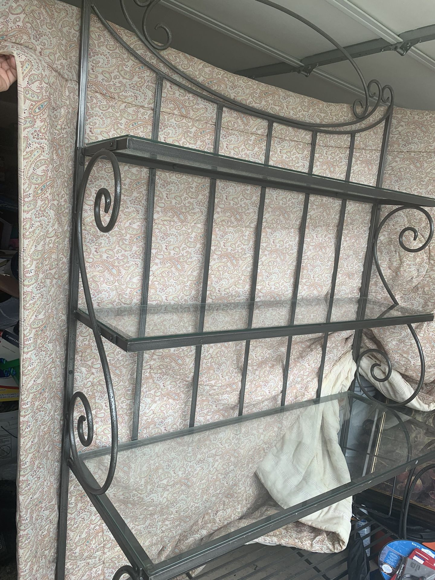 Wrought iron Baker rack is in good condition 