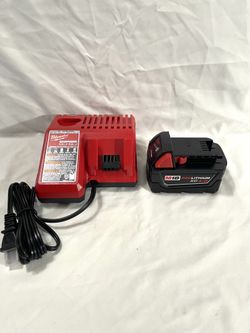 Brand new Milwaukee XC4Ah battery brand new charger